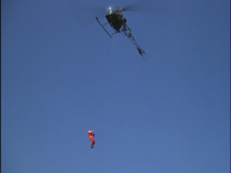 Santa Claus dropping out of a chopper